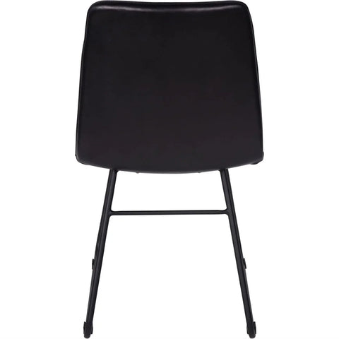 Back view of a charcoal leather dining chair with sleek black legs.