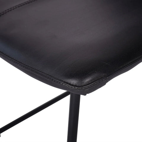Charcoal leather chair seat with visible stitching detail.
