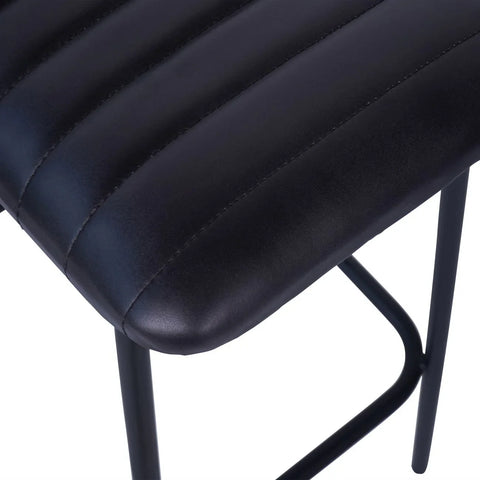 Charcoal leather bar stool seat with ribbed texture and black metal legs.