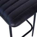 Charcoal leather bar stool seat with ribbed texture and black metal legs.