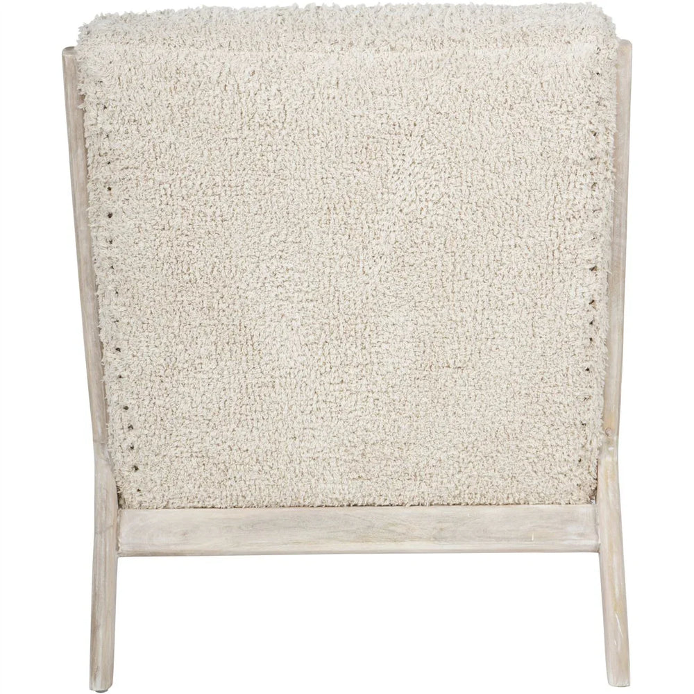Beige textured chair back with light wood frame.