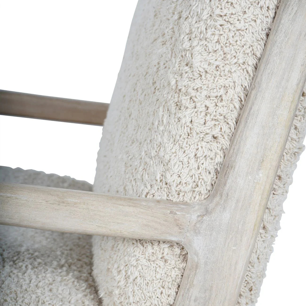 Beige textured chair fabric with light wood frame detail.