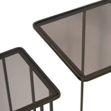 Dark gold metal side tables with glass tops, angled view.