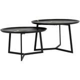 Black round coffee tables with sleek metal legs.