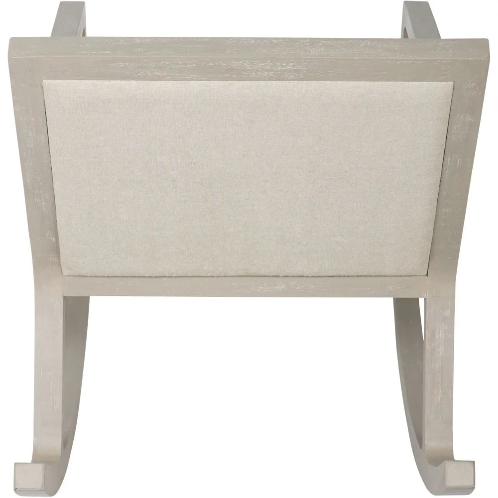 Beige fabric rocking chair backrest with light wood frame.