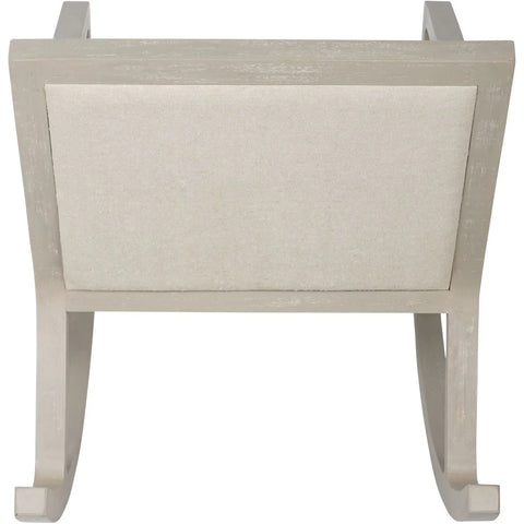 Beige fabric rocking chair backrest with light wood frame.