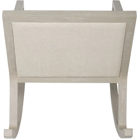 Beige fabric rocking chair backrest with light wood frame.