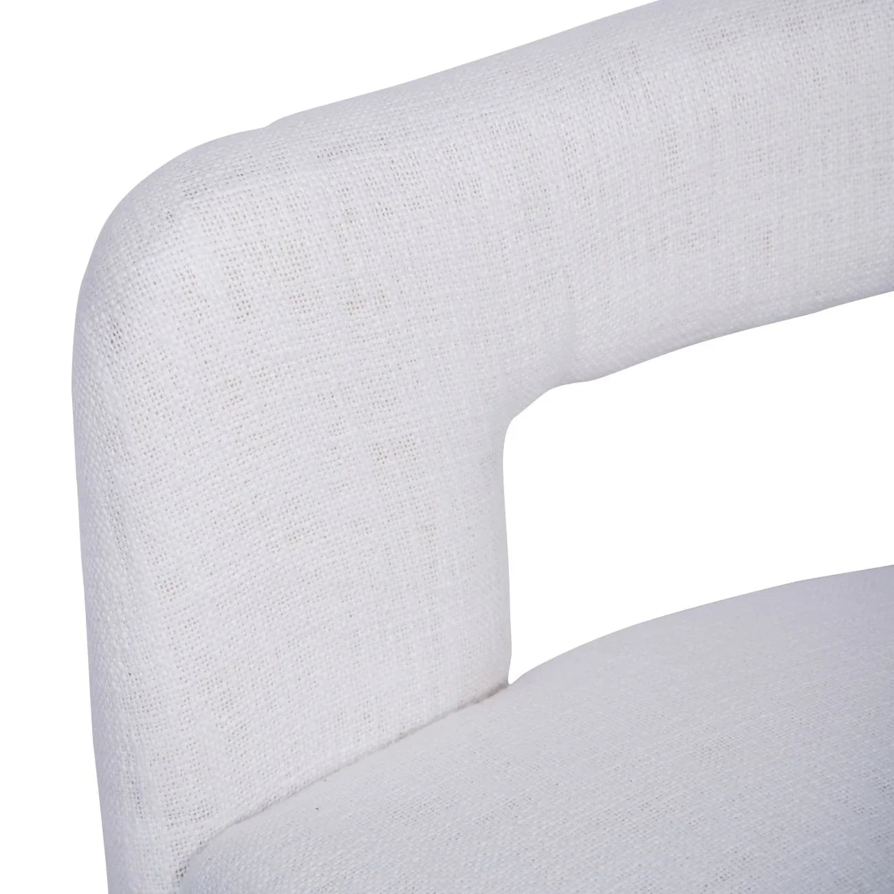 Ivory chair close-up showing textured fabric and curved backrest.