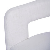 Ivory chair close-up showing textured fabric and curved backrest.
