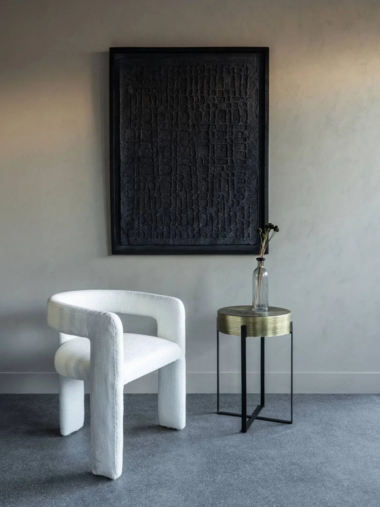 Ivory slub chair in modern room with textured artwork and a small side table.