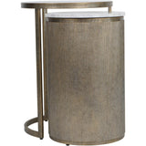 Aged gold nesting tables with ribbed texture and marble tops.