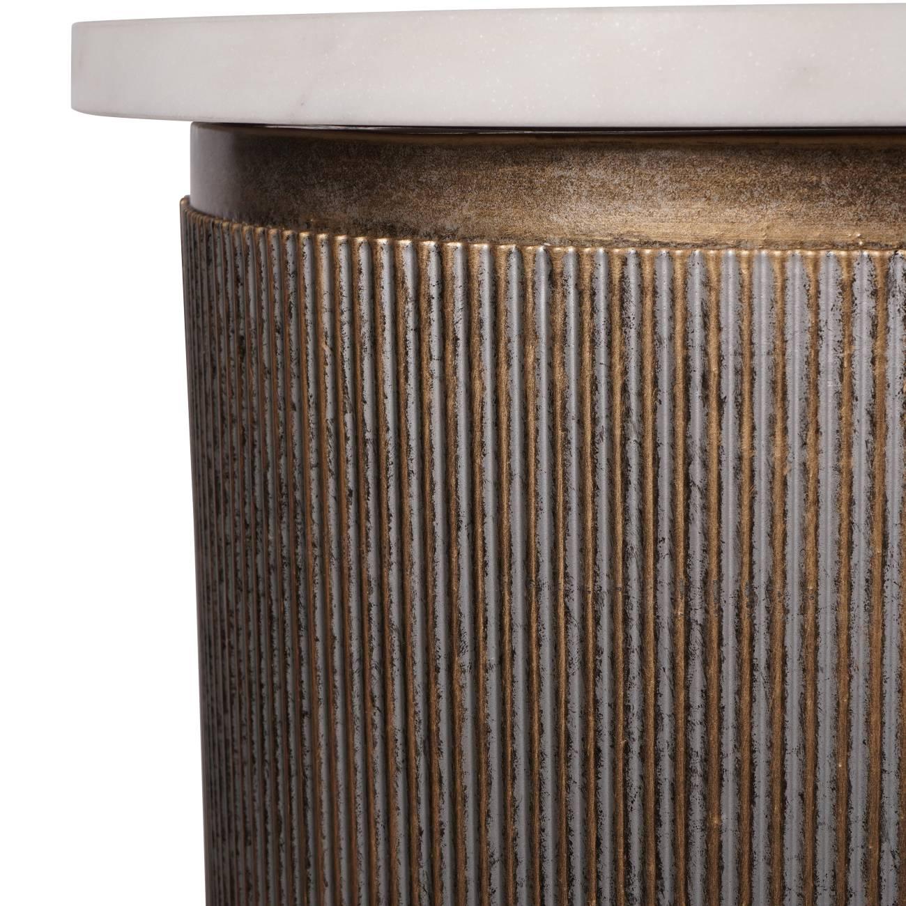 Ribbed aged gold console detail with white marble top.
