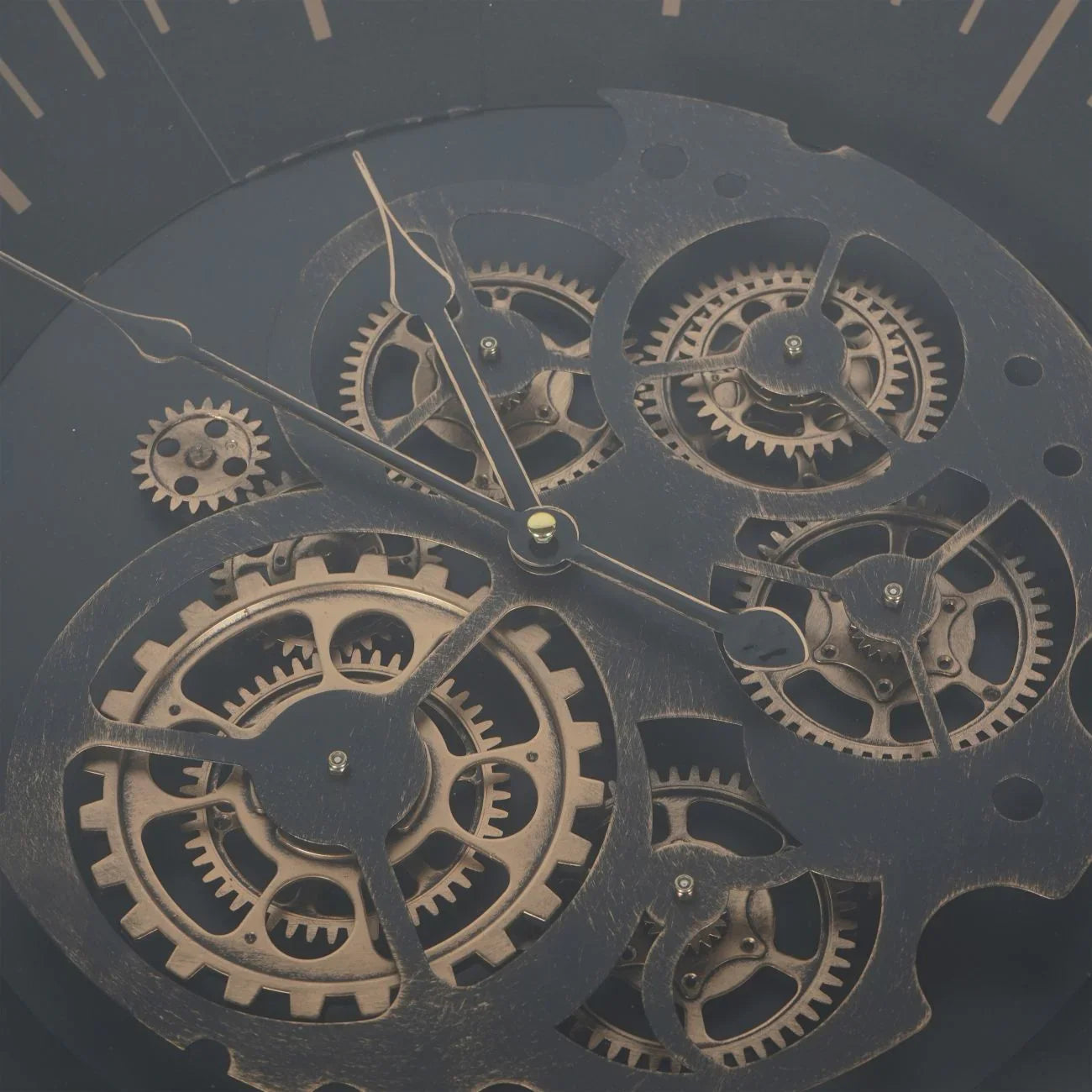 Black and gold clock face with intricate moving cogs detail.