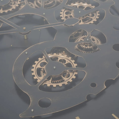 Black and gold table detail with intricate moving cogs.