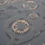 Black and gold table detail with intricate moving cogs.