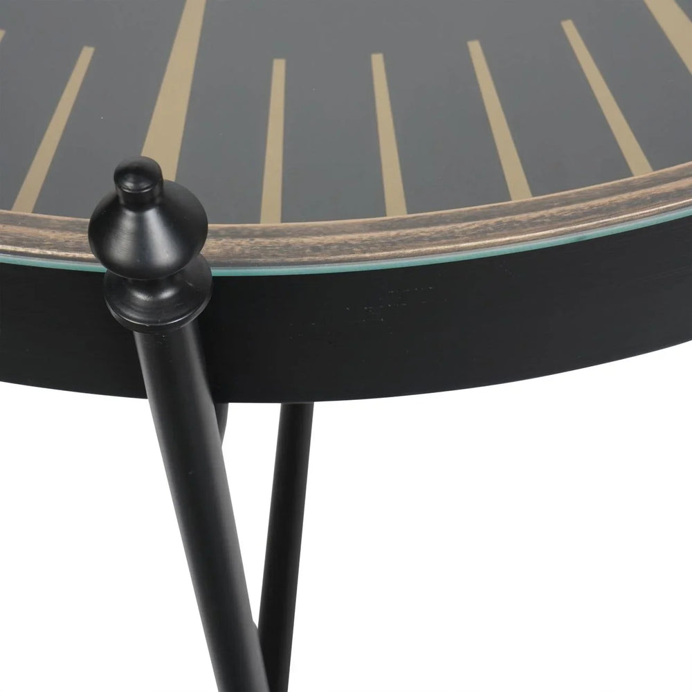 Black and gold table edge with sleek black legs and decorative knob detail.