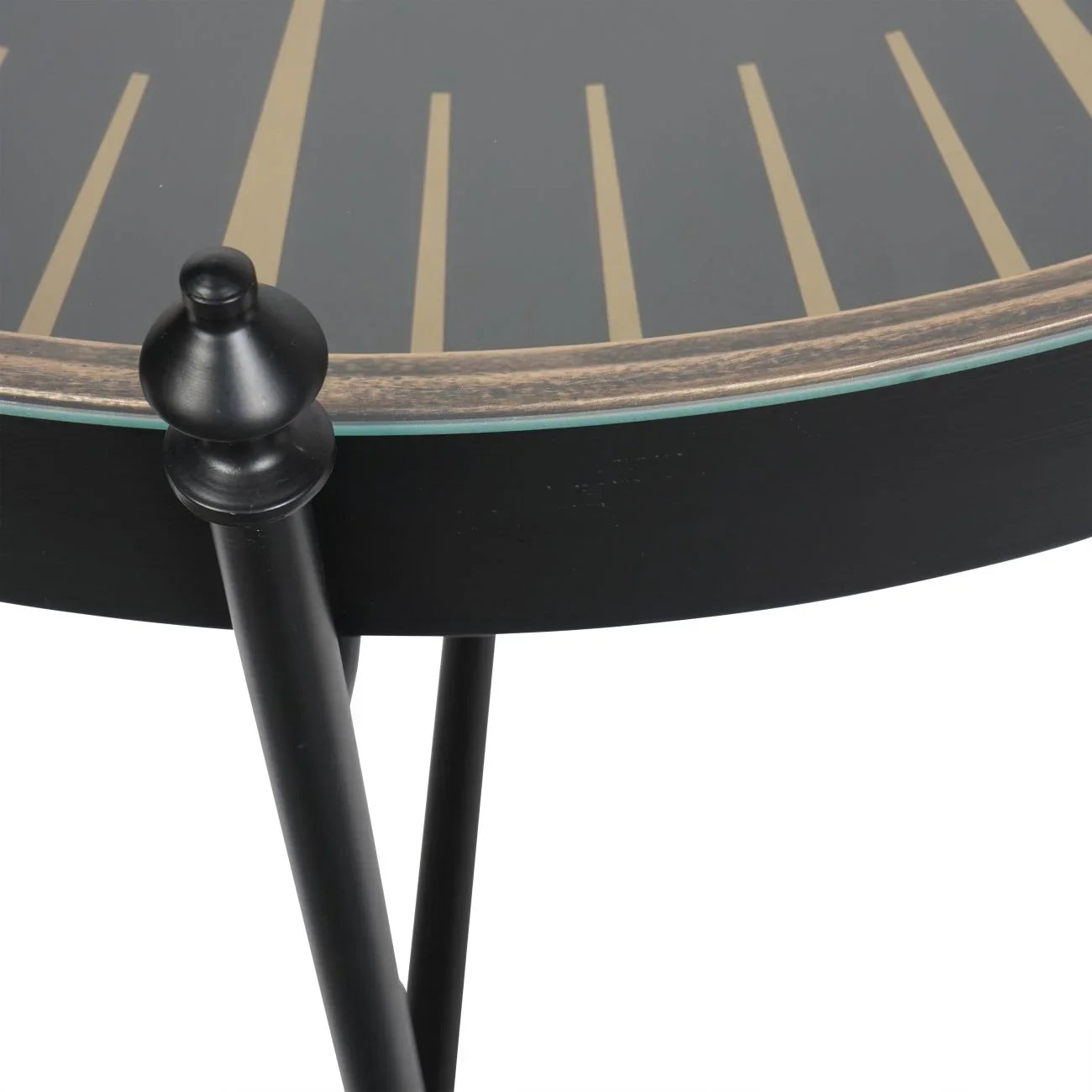 Black and gold table edge with sleek black legs and decorative knob detail.