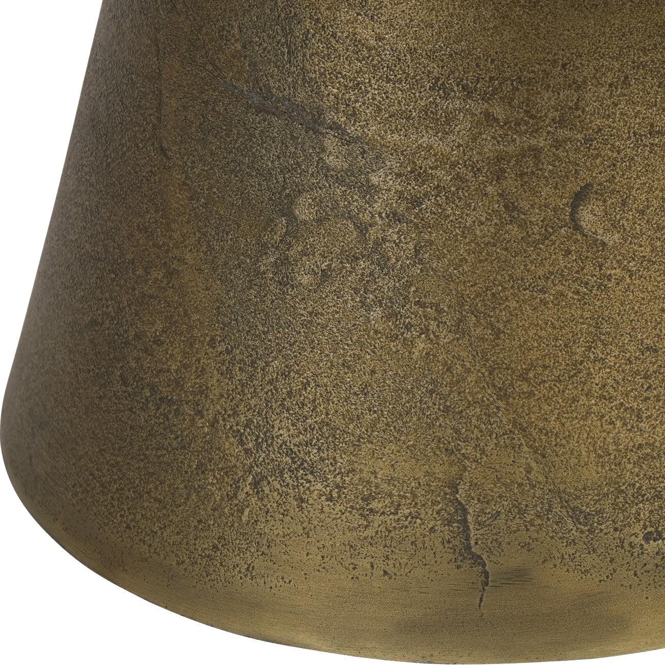 Antique brass table base with textured surface detail.