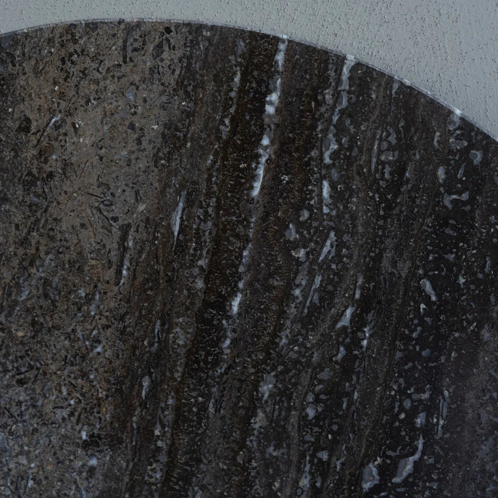 Dark travertine surface with rich, textured veining patterns.