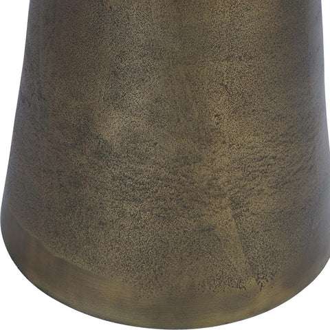 Bronze textured base of a side table with a smooth finish.