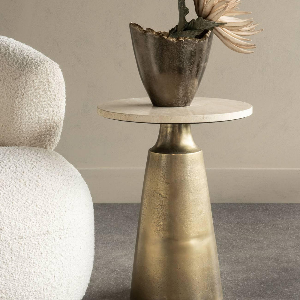 Bronze base side table with travertine top, styled with decorative vase.