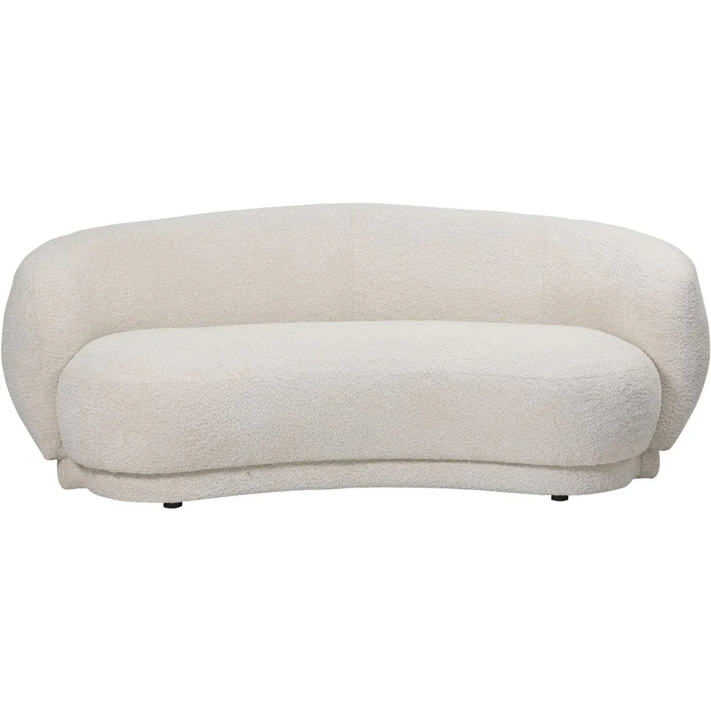 Cream curved sofa with textured fabric and rounded backrest.