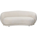 Cream curved sofa with textured fabric and rounded backrest.