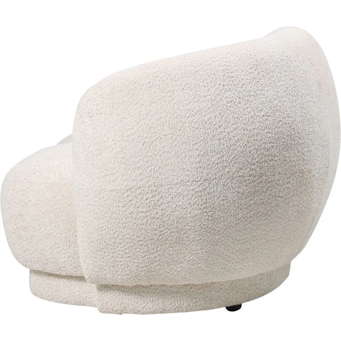 Cream sofa showcasing curved back and textured upholstery.
