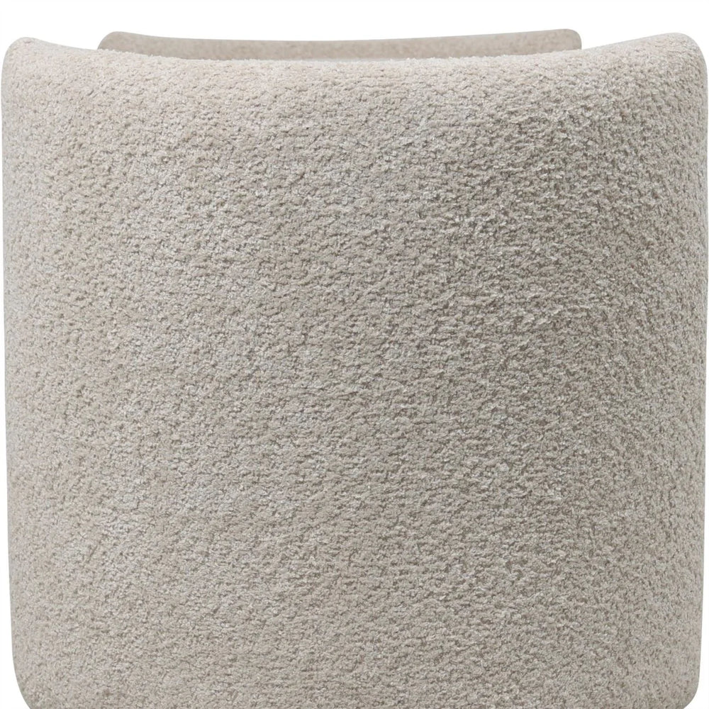 Cream textured fabric detail on storage bench surface.