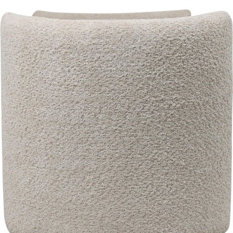 Cream textured fabric detail on storage bench surface.