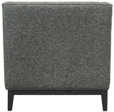 Forest green armchair back view with textured fabric and dark wooden legs.
