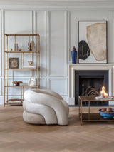 Brushed champagne shelving unit in elegant living room with modern decor.