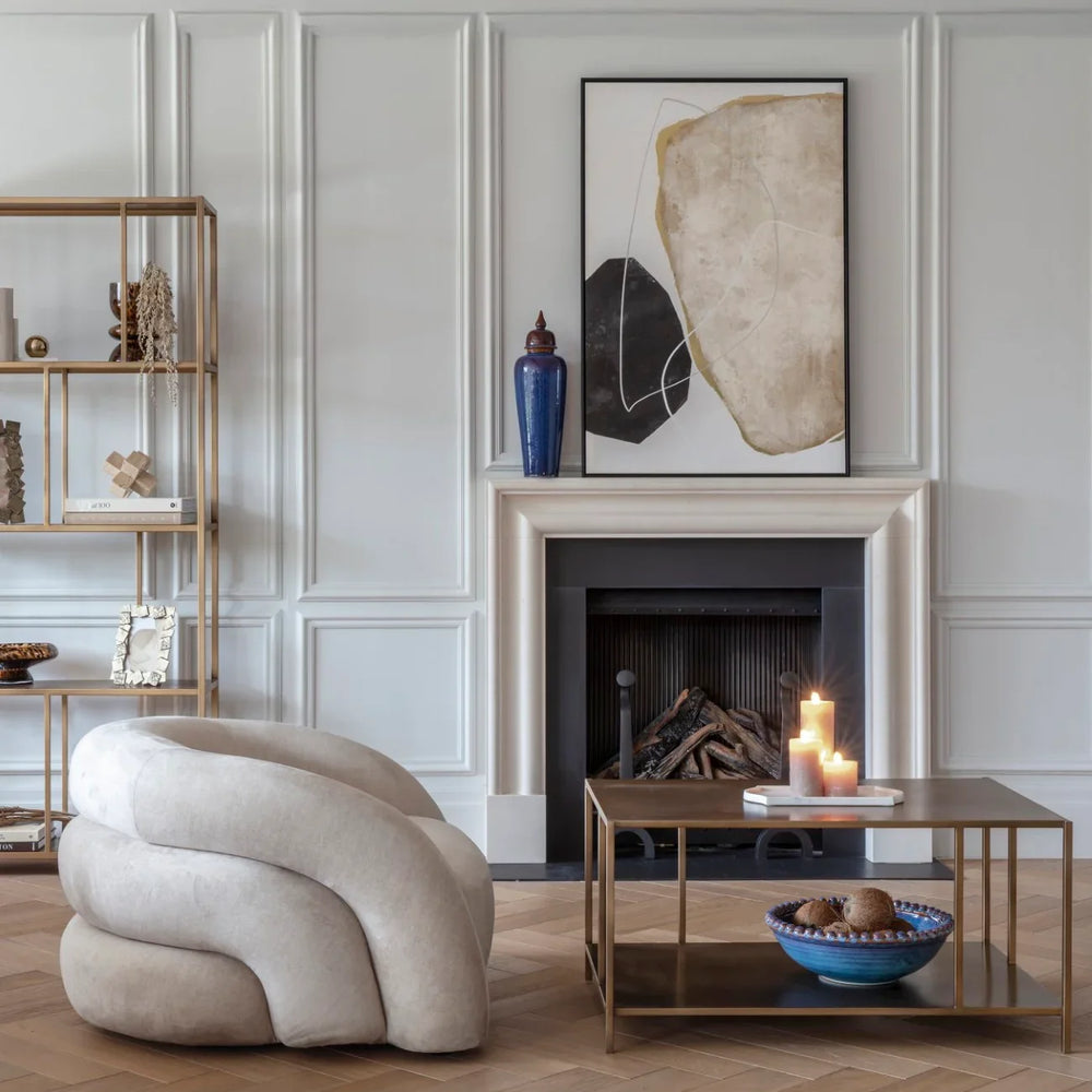 Brushed champagne coffee table in elegant living room with modern decor.