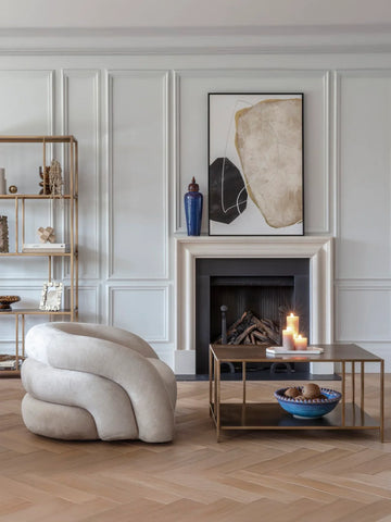 Brushed champagne coffee table in elegant living room with modern decor.