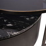 Black nesting coffee tables with marble texture and ribbed edge detail.