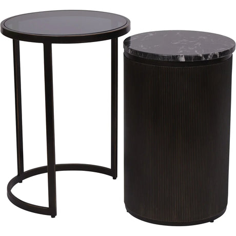Black nesting side tables with round tops and sleek bases.