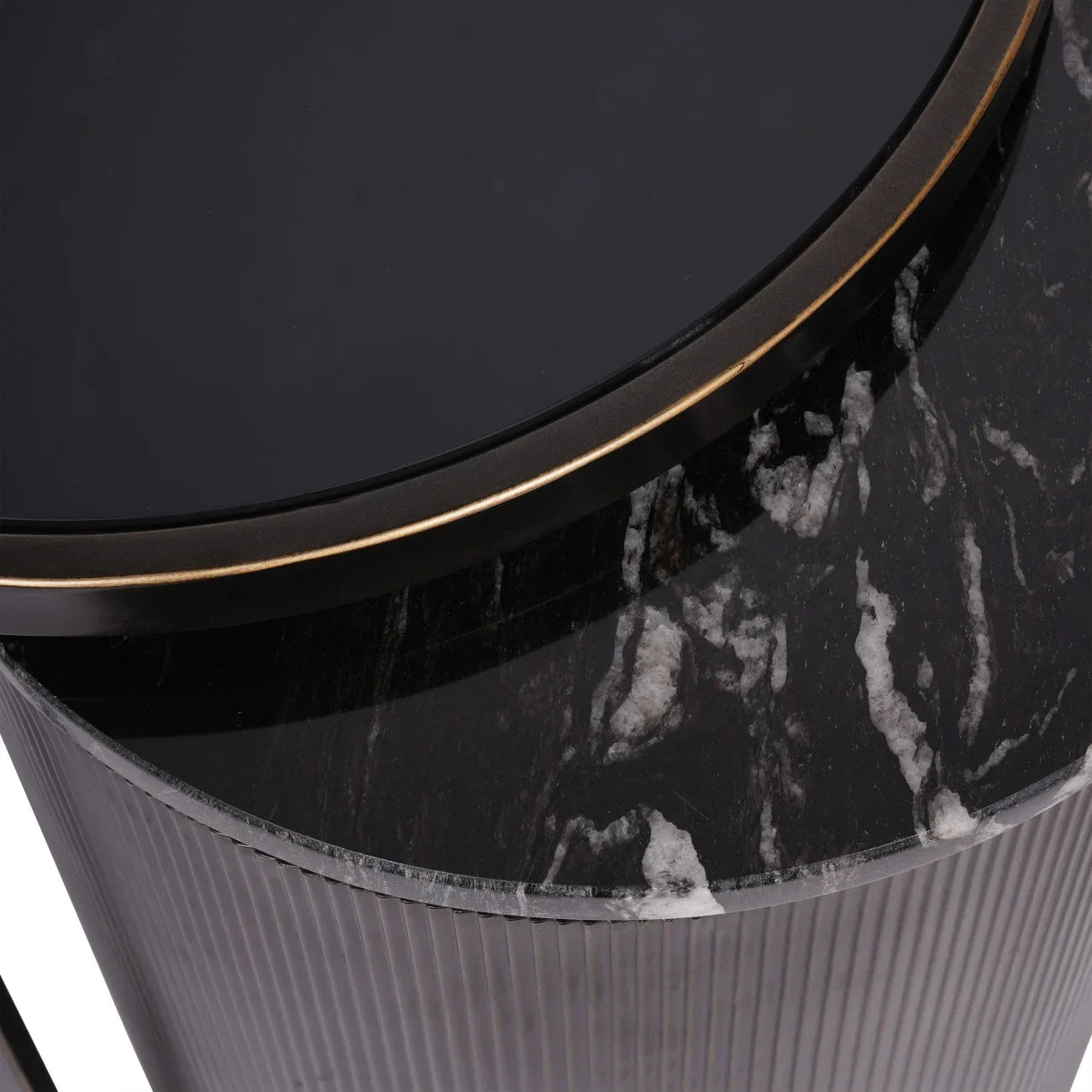 Black nesting table with marble texture and gold trim detail.