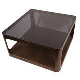 Dark glass square coffee table with bronze metal frame and lower shelf.