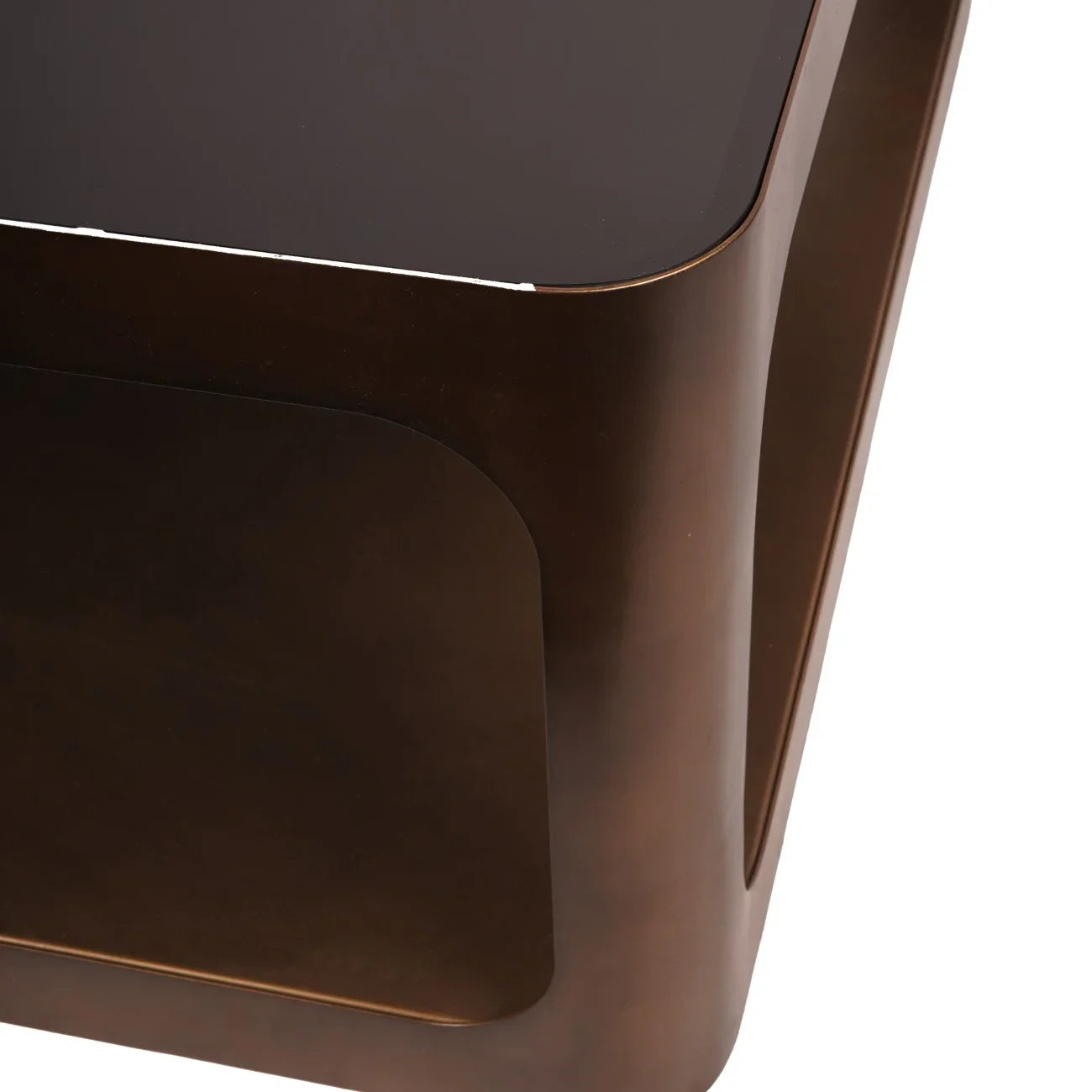 Bronze metal coffee table corner with dark glass top.