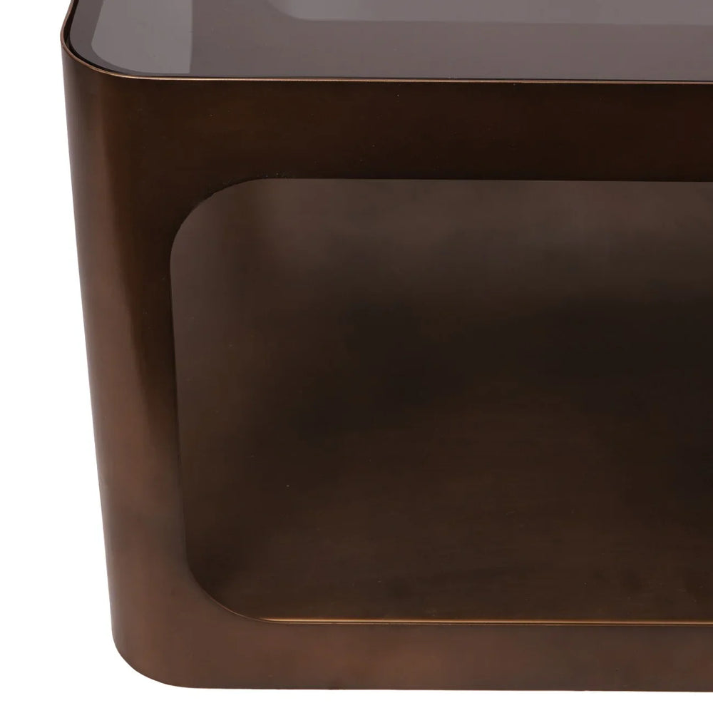 Bronze metal coffee table corner with glass top detail.