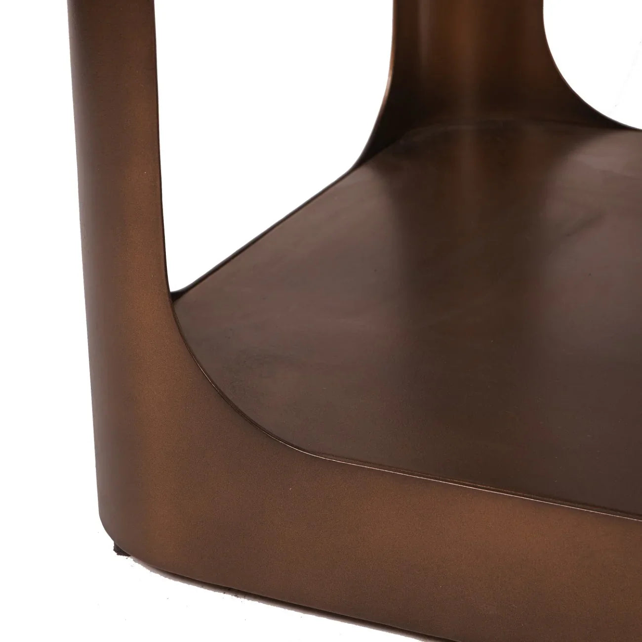 Bronze metal console table corner with smooth finish.