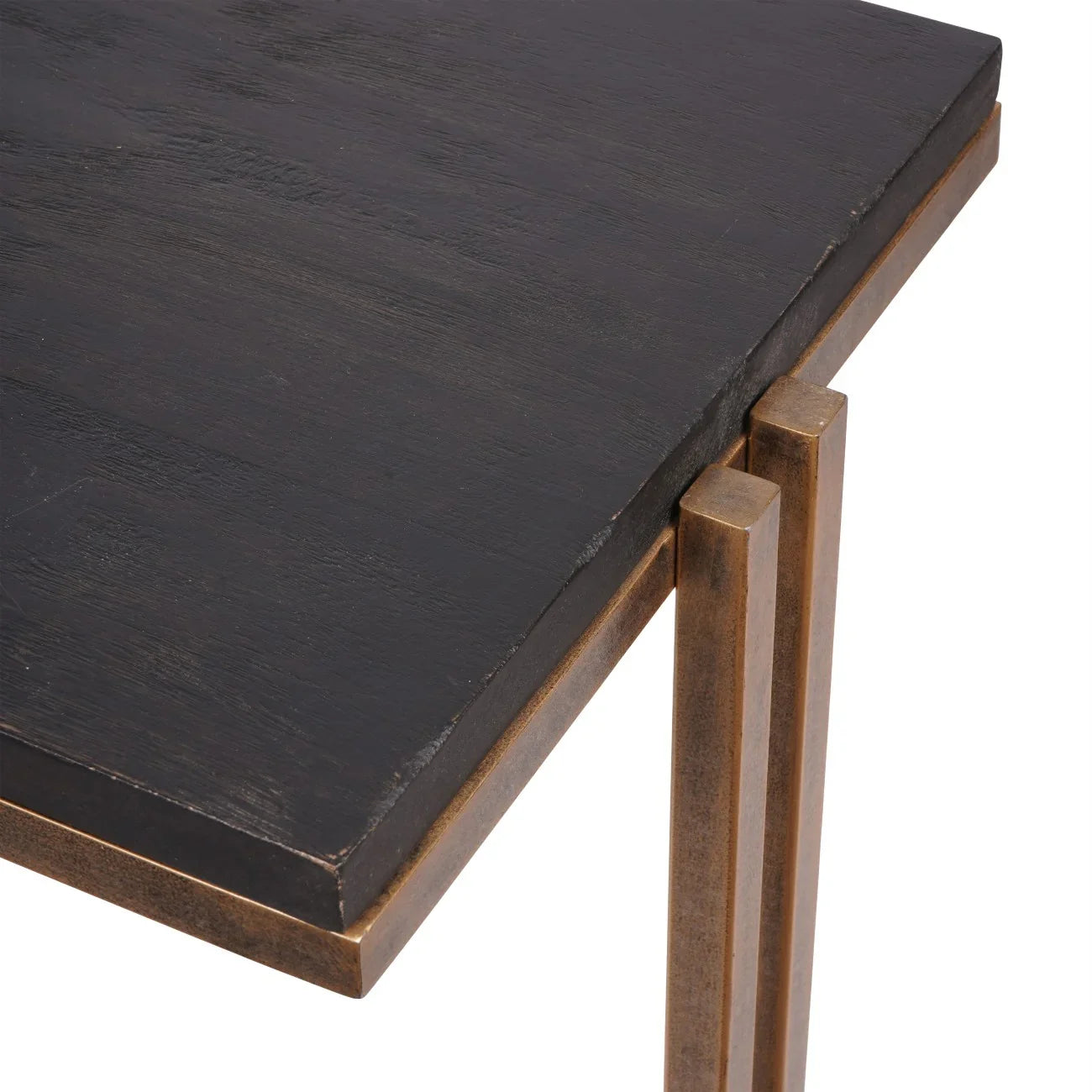 Black wood tabletop with champagne metal legs detail.