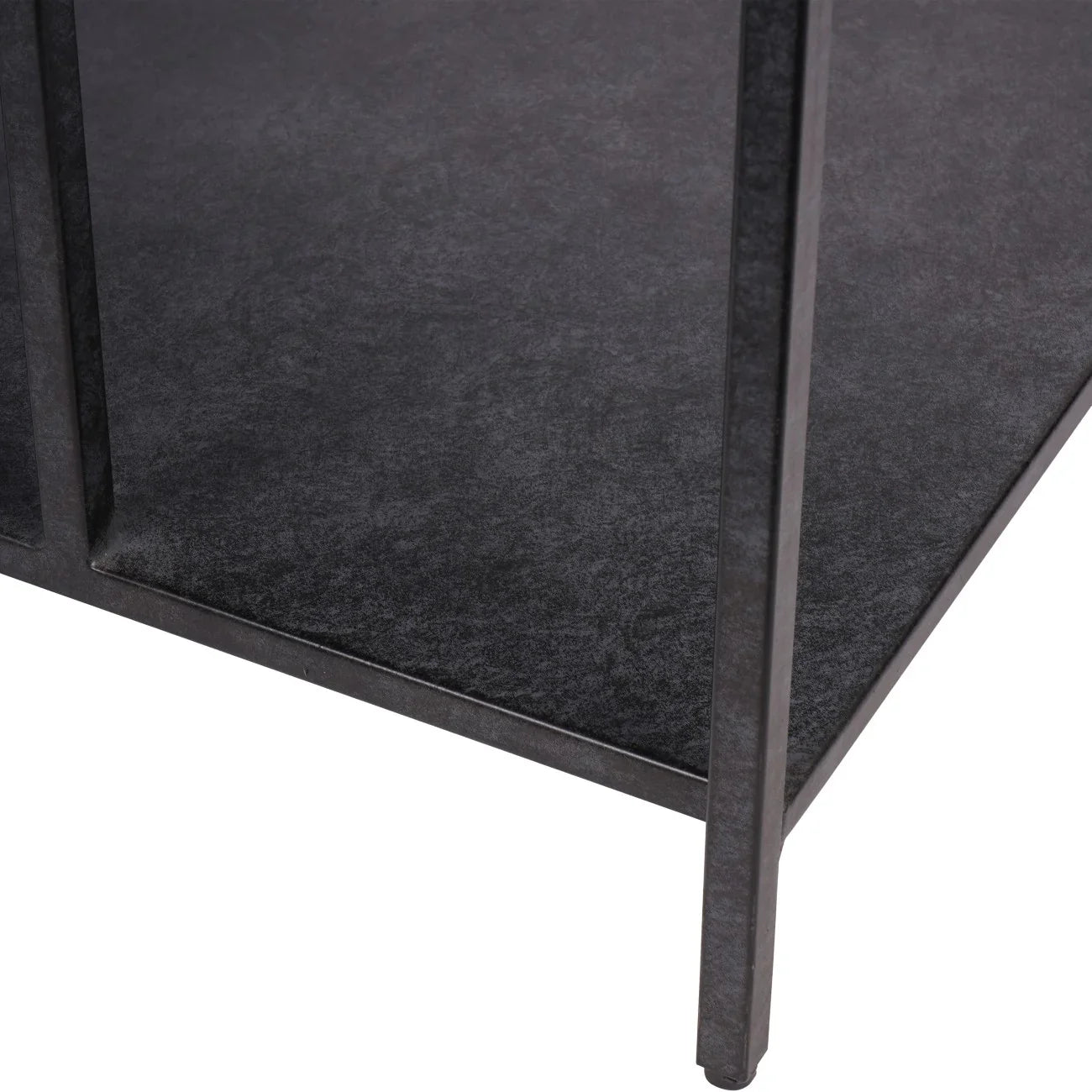 Dark mottled surface with sleek metal legs of a coffee table.