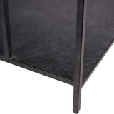 Dark mottled surface with sleek metal legs of a coffee table.