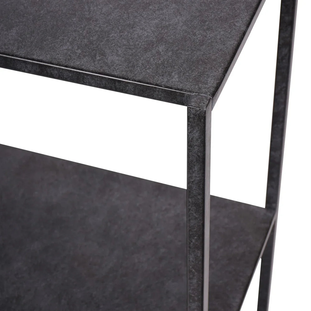 Dark mottled finish console table corner detail.