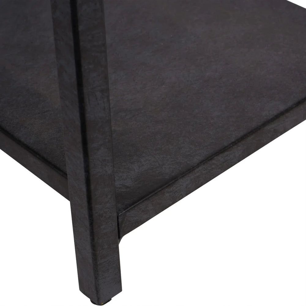 Mottled black metal shelf corner with textured finish.