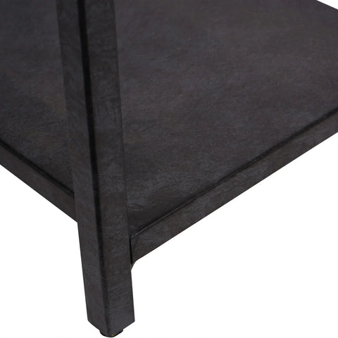 Mottled black metal shelf corner with textured finish.