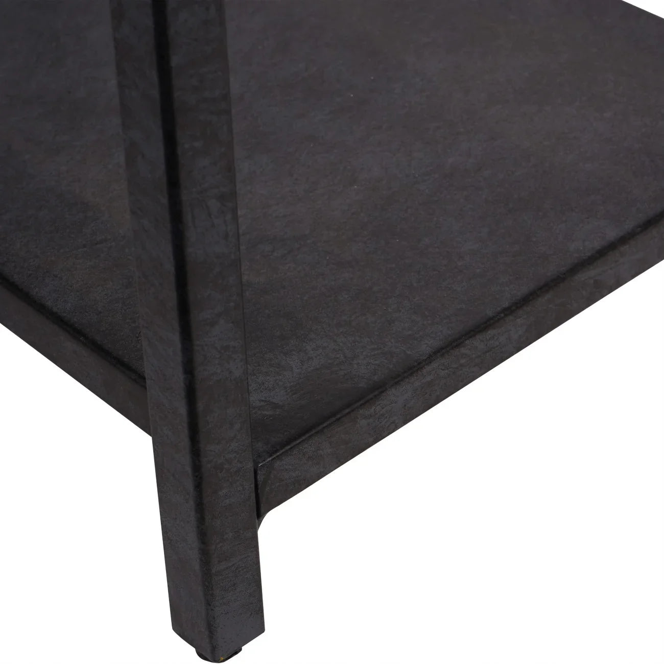 Mottled black metal shelf corner with textured finish.