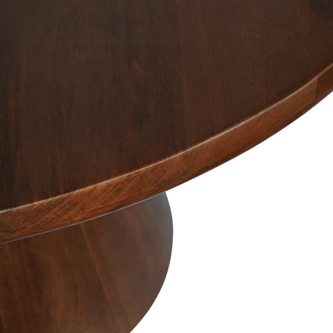 Dark wood dining table edge with smooth, polished finish.
