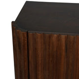 Dark wood sideboard corner with scalloped edge design